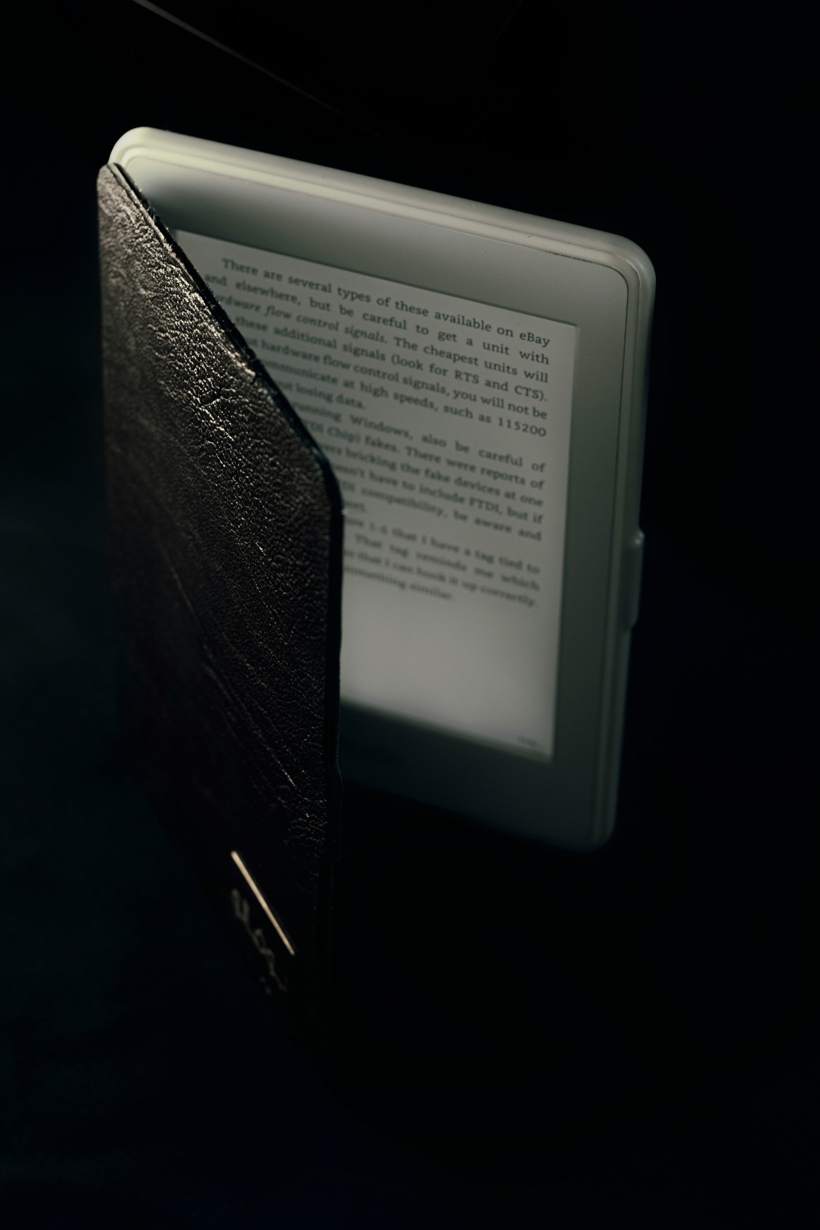 Person enjoying a book on a Kindle